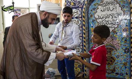 Financial assistance and in-kind gifts distributed by the Children Division at the Al-Abbas's (p) holy shrine to the martyrs' orphans.