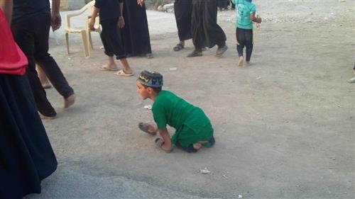 A boy with special needs is heading to the Ziyarat of Imam al-Hussayn (PBUH).