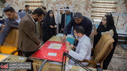 A Quranic Studies delegation visits Imam Hussein manuscript center.